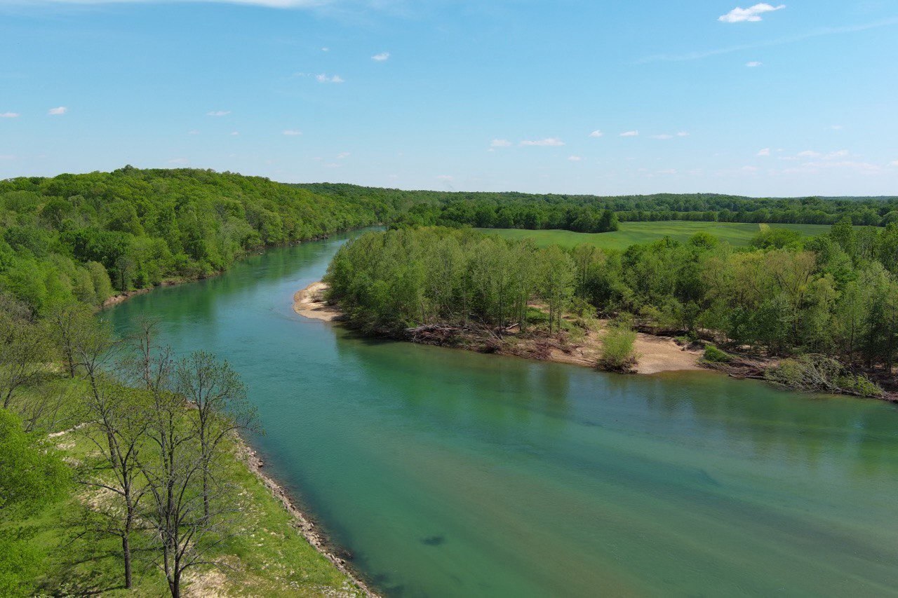 Current River in the Ozark foothills with clear live-water frontage and surrounding forest